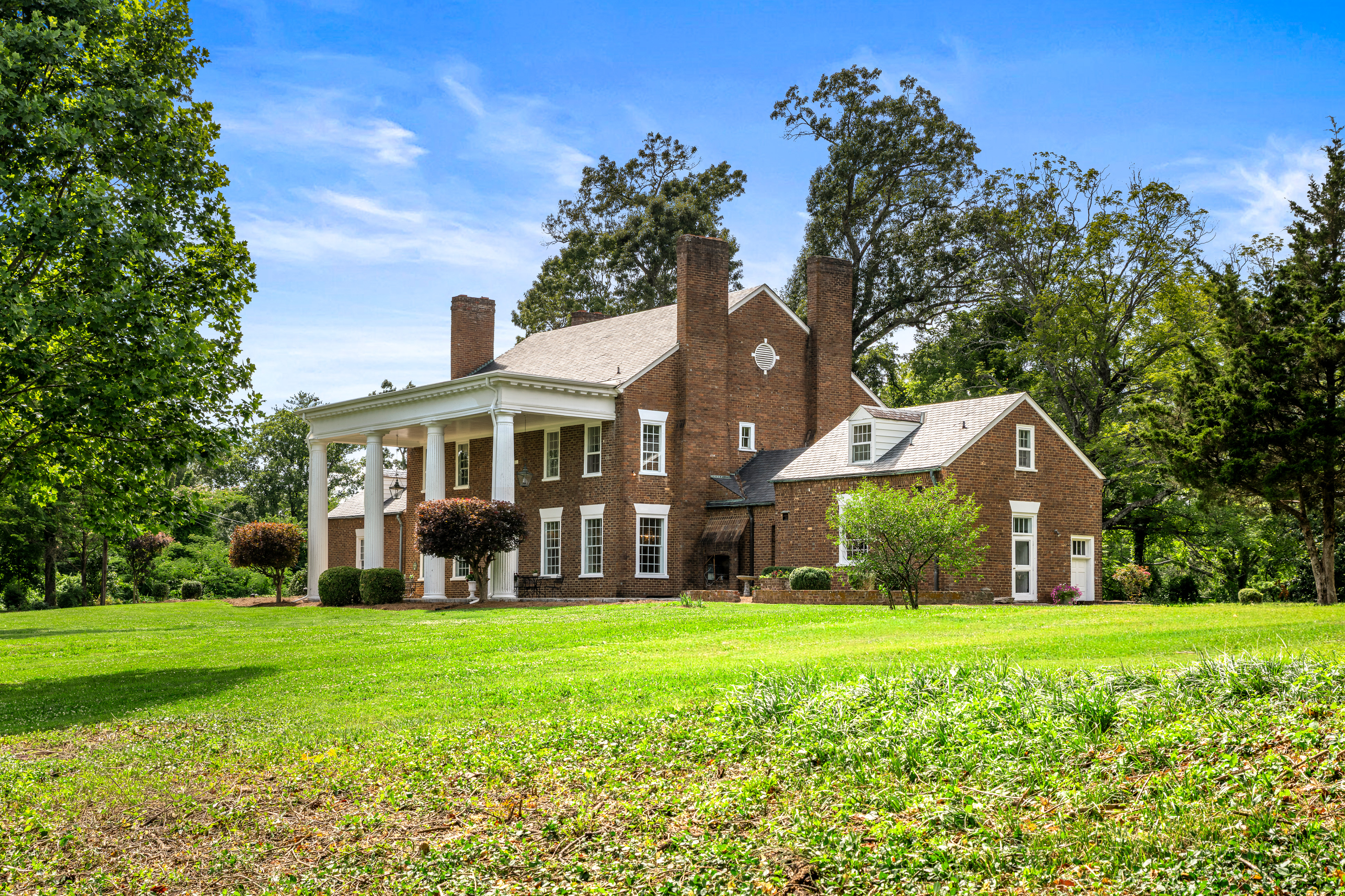 The full elevation across the open lawn