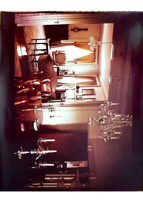 Twin drawing rooms — chandeliers and gilded candelabra