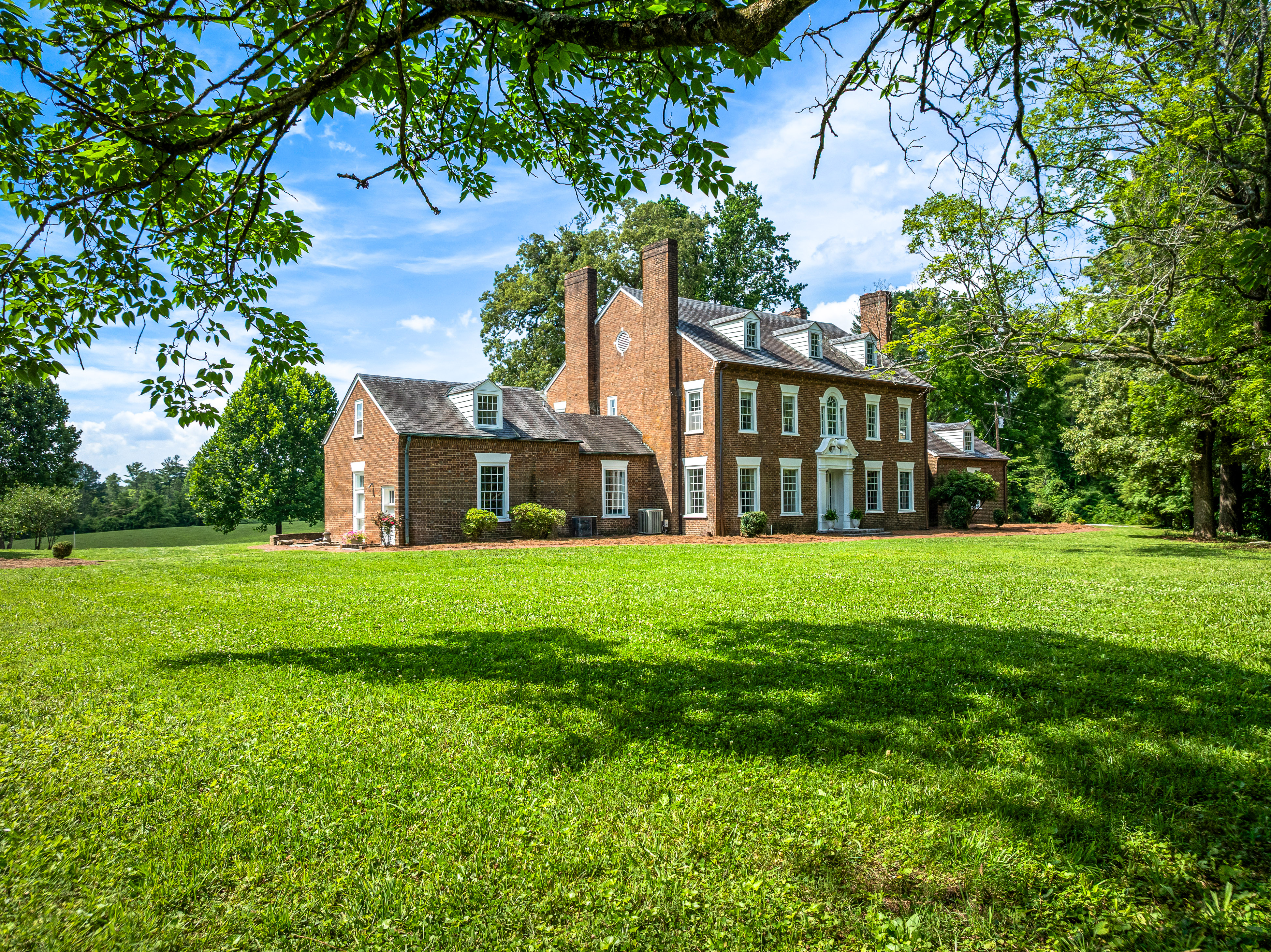 The manor viewed across the open lawn