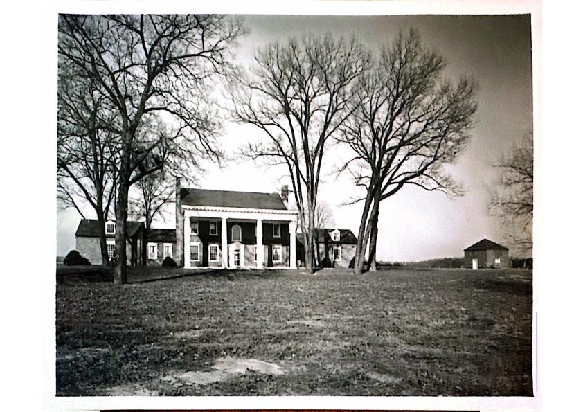 The manor across the meadow — mid-century archival photograph