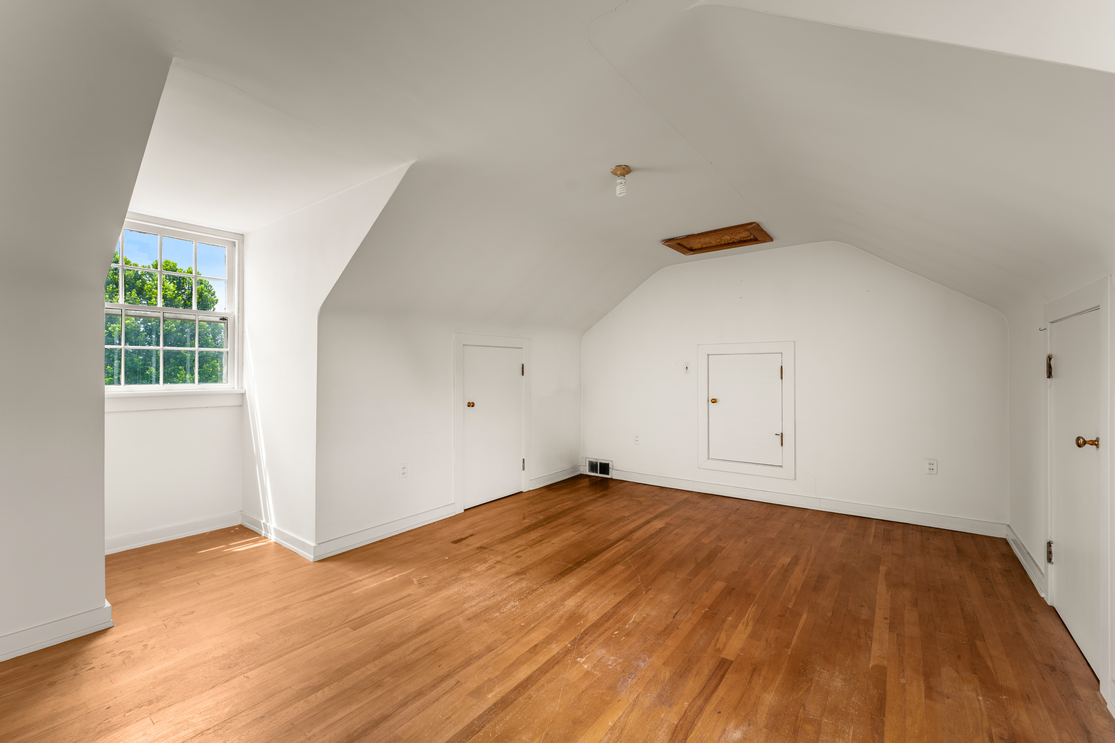 A back stair to the attic with louvered shutters