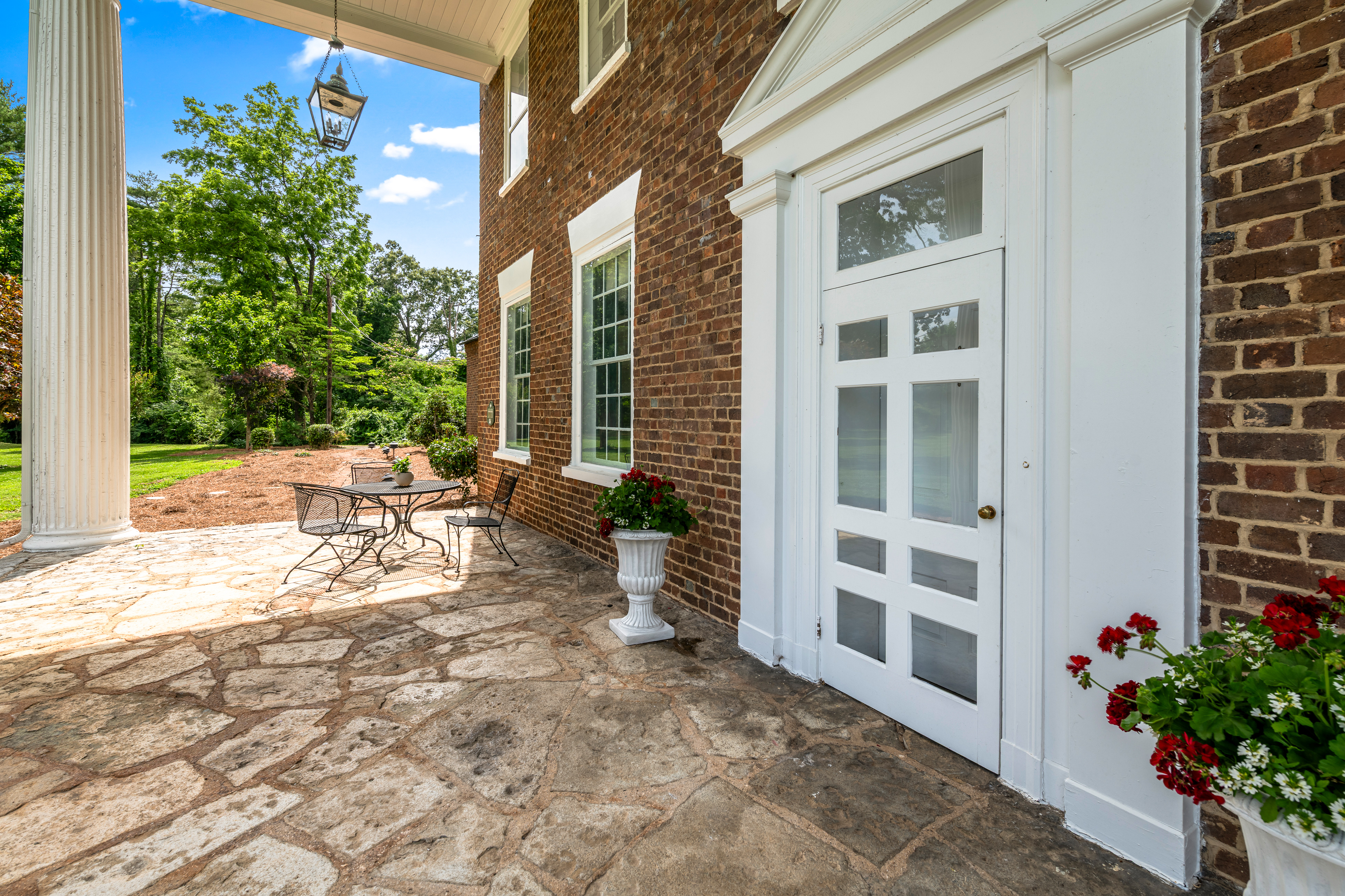 The side entrance opening onto the rear terrace
