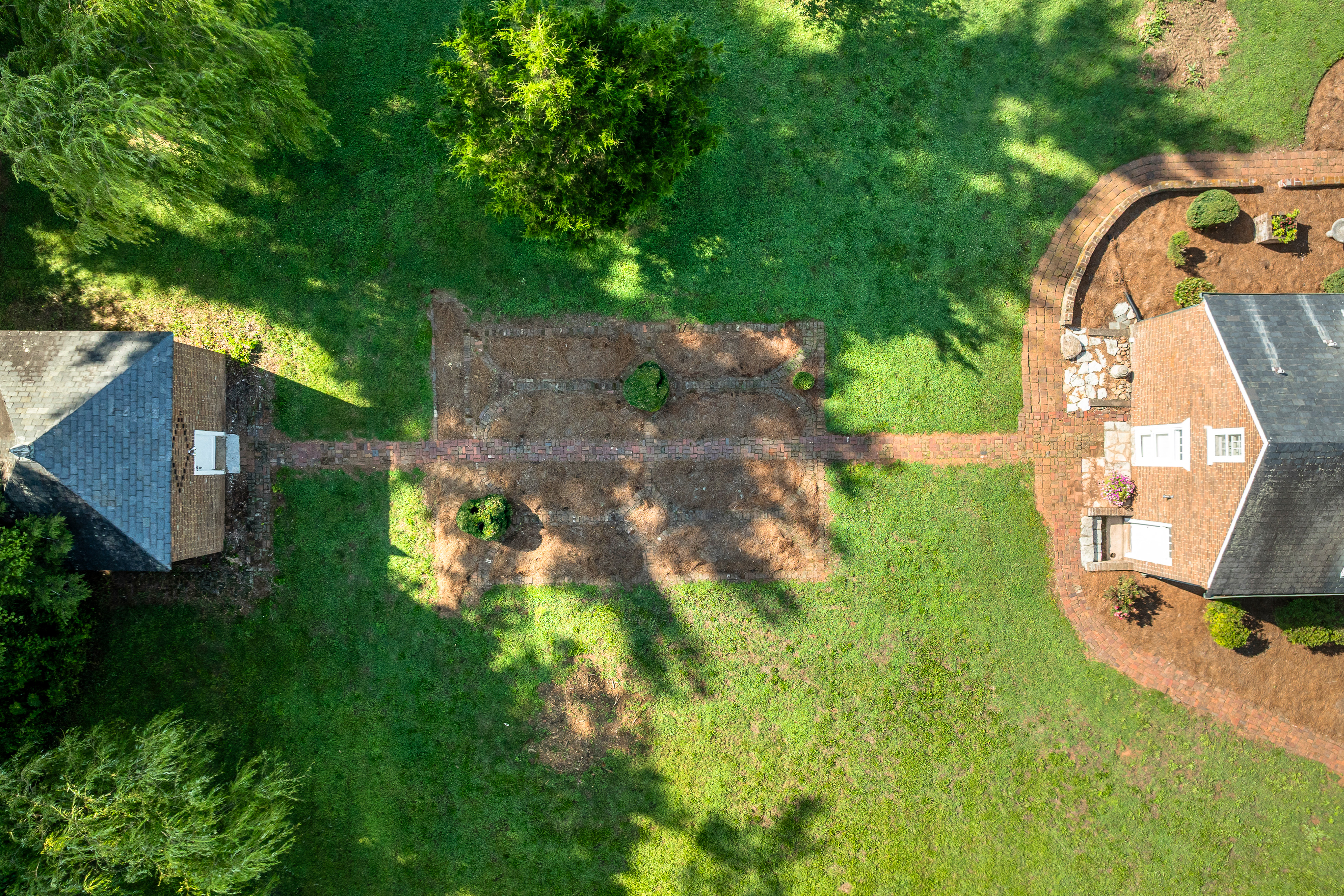 Aerial: the smoke house on axis with the manor's rear wing
