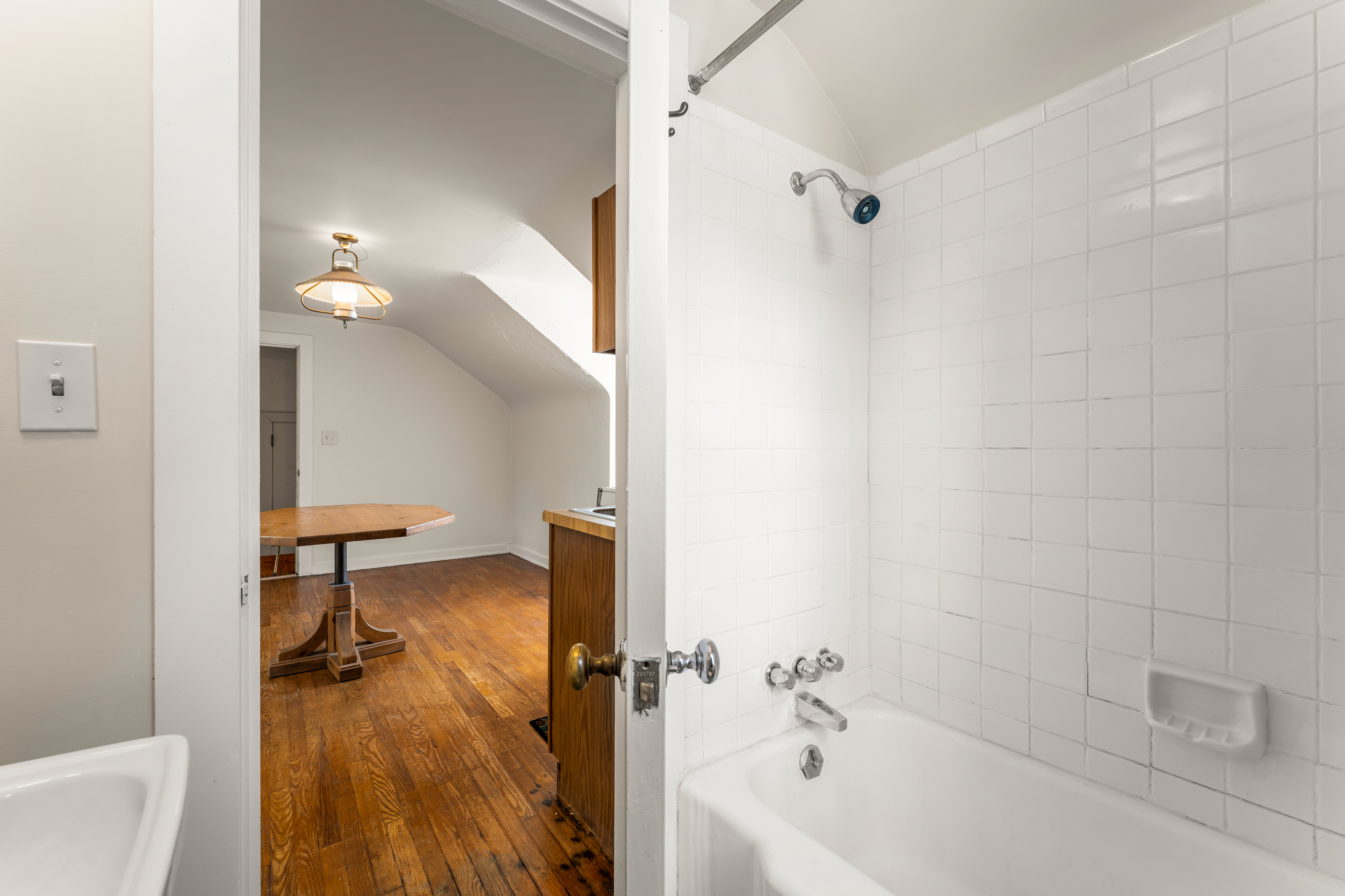 The apartment bath, alternate view with wall-hung basin
