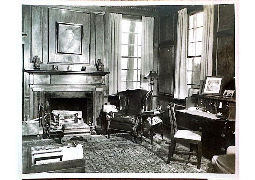 The library — mantel clock and paneled bookcases