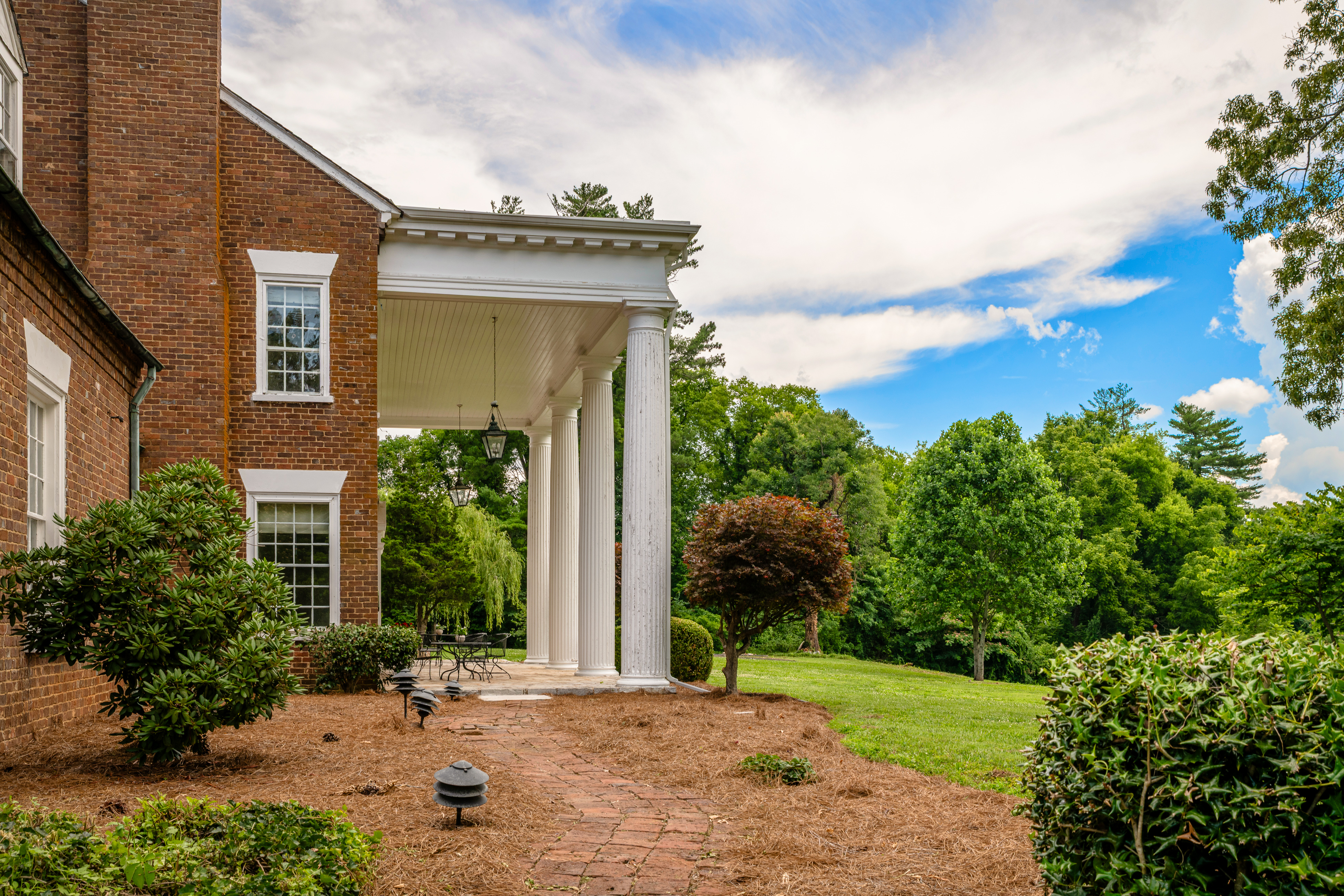 The great lawn beneath the canopy of hardwoods