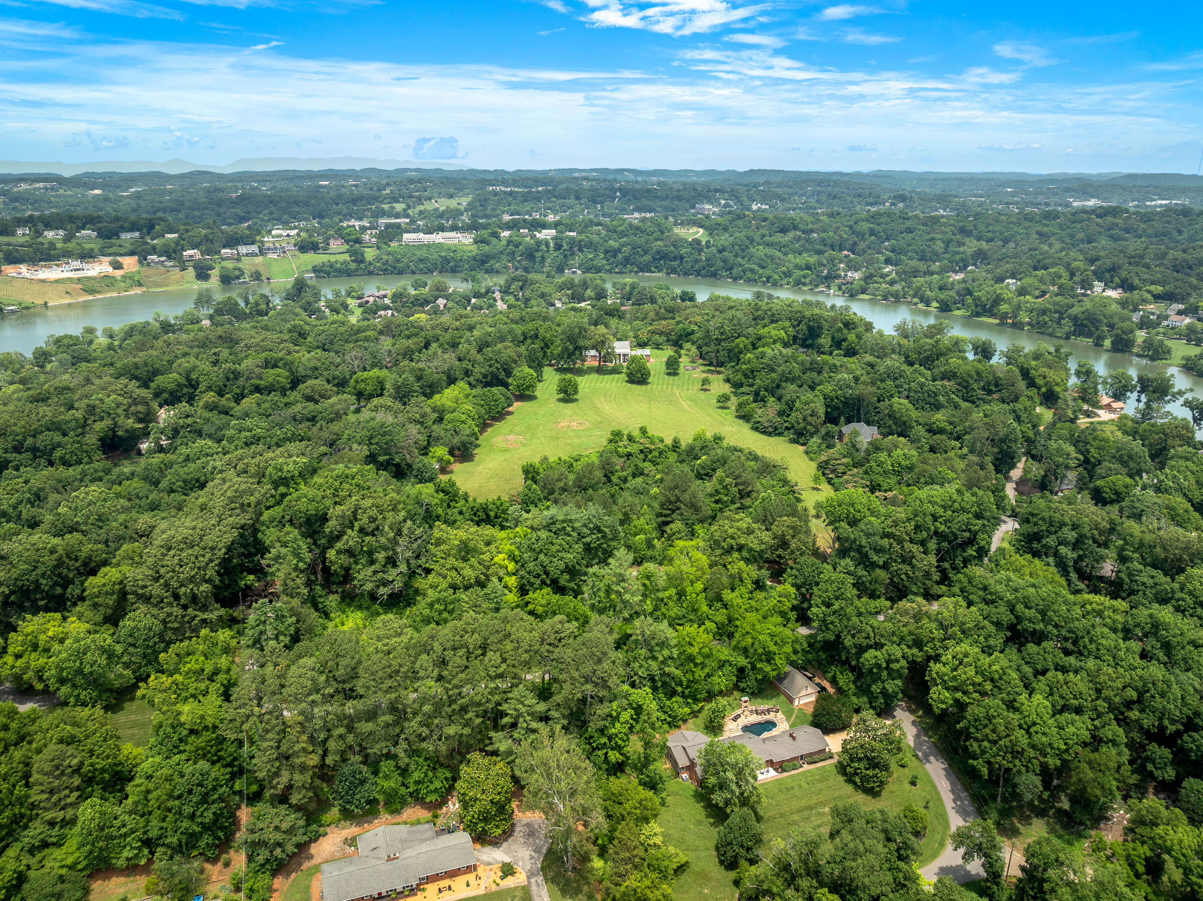 Aerial: the estate clearing above the river valley