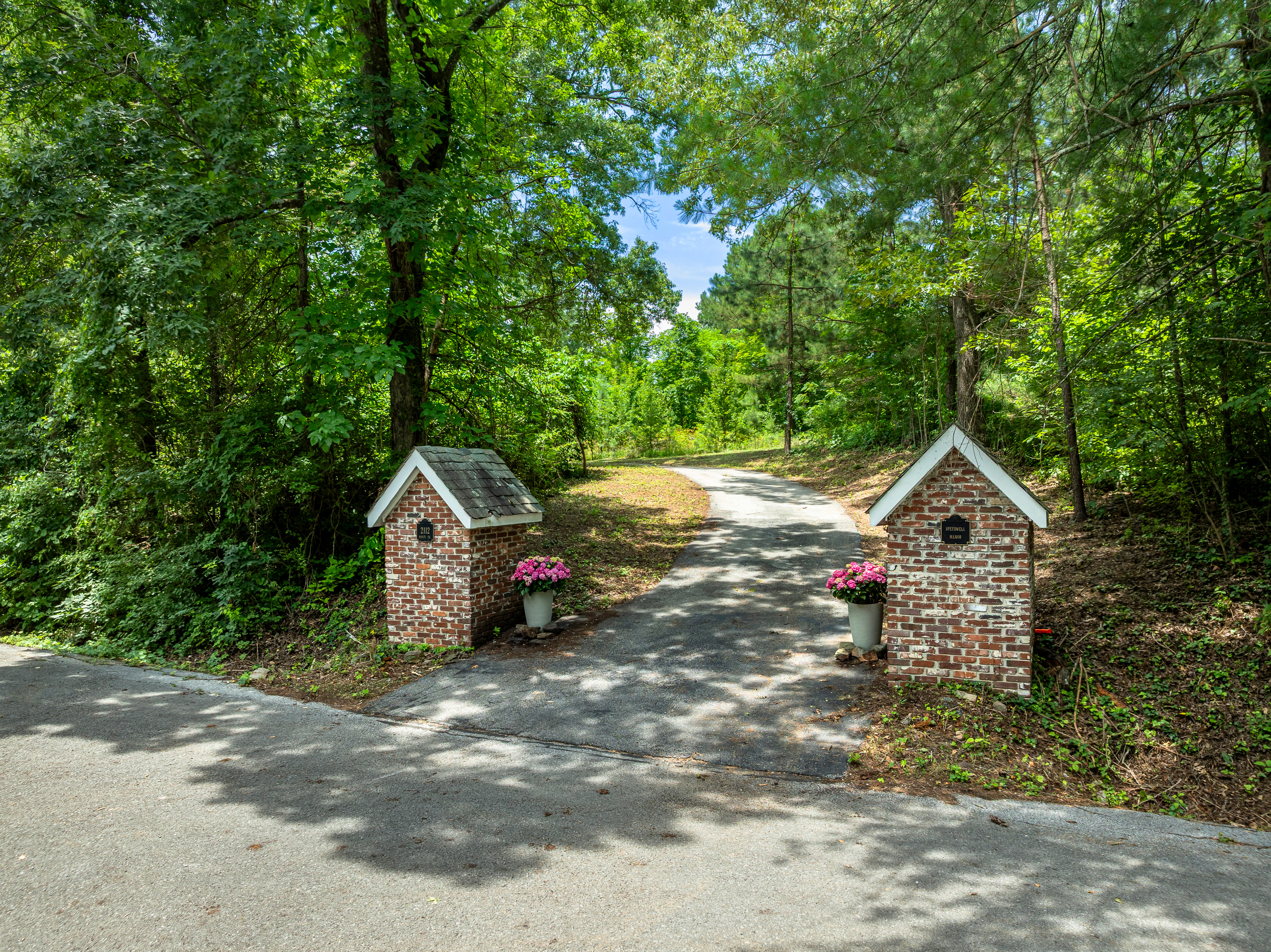 The brick entry markers at Speedwell Manor's drive
